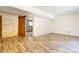 The basement has light-colored wood floors, bright white walls, and a rustic sliding wood barn door at 11861 Nc Hwy 73 E Hwy, Mount Pleasant, NC 28124