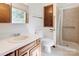 Bathroom with a white vanity, ceramic tile floors, and a shower with grab bars at 11861 Nc Hwy 73 E Hwy, Mount Pleasant, NC 28124