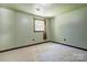 A cozy bedroom featuring carpet flooring, a neutral wall color, and a bright window at 11861 Nc Hwy 73 E Hwy, Mount Pleasant, NC 28124