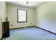 This bedroom features a window for natural light, carpet flooring and light colored walls at 11861 Nc Hwy 73 E Hwy, Mount Pleasant, NC 28124