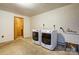 The laundry room features a large washing machine and dryer as well as a utility sink at 11861 Nc Hwy 73 E Hwy, Mount Pleasant, NC 28124