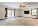 Spacious living room with French doors leading to an outdoor deck and ceiling fan at 11861 Nc Hwy 73 E Hwy, Mount Pleasant, NC 28124