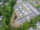 Aerial view of townhome community surrounded by lush greenery offering a tranquil living environment at 13022 Simoneaux Ln, Charlotte, NC 28277