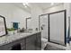 Modern bathroom featuring a granite countertop vanity, glass-enclosed shower, and sleek fixtures at 13022 Simoneaux Ln, Charlotte, NC 28277