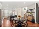 Open floor plan features a dining area, modern kitchen, and staircase at 13022 Simoneaux Ln, Charlotte, NC 28277