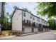 Modern townhome with garages and rooftop terraces providing attractive outdoor spaces with clean architectural lines at 13022 Simoneaux Ln, Charlotte, NC 28277