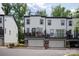 Townhome exterior with garage, balconies, and modern architecture offering comfortable outdoor living spaces at 13022 Simoneaux Ln, Charlotte, NC 28277