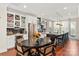 Open kitchen dining area with stainless appliances, island, and modern decor at 13022 Simoneaux Ln, Charlotte, NC 28277
