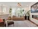 Inviting living space with a plush sofa, modern fireplace, neutral tones, and large windows at 13022 Simoneaux Ln, Charlotte, NC 28277