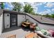 Charming outdoor patio with a wooden table, bench, and seating area, perfect for relaxed outdoor dining at 13022 Simoneaux Ln, Charlotte, NC 28277