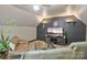 Basement lounge area with large screen TV and comfortable seating at 131 Sierra Woods Dr, Troutman, NC 28166