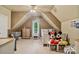 Neutral-toned bedroom with vaulted ceilings features decor and plenty of natural light at 131 Sierra Woods Dr, Troutman, NC 28166