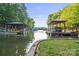 Picturesque waterfront with multiple boat docks and tranquil lake views, perfect for boating enthusiasts at 131 Sierra Woods Dr, Troutman, NC 28166