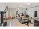 Home gym featuring fitness equipment, mirrors, and windows providing natural light at 131 Sierra Woods Dr, Troutman, NC 28166