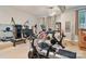 Spacious home gym with modern fitness equipment and plenty of natural light at 131 Sierra Woods Dr, Troutman, NC 28166