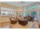 Spacious living room with an open layout to the kitchen and dining area, featuring hardwood floors and ample natural light at 131 Sierra Woods Dr, Troutman, NC 28166