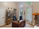 Bright home office with large desk, shelving, and ample natural light at 131 Sierra Woods Dr, Troutman, NC 28166