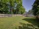 Spacious backyard with a wooden fence and lush green grass, perfect for outdoor activities at 1324 E 35Th St, Charlotte, NC 28205