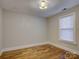 This bedroom features hardwood floors, a window, and is ready to be customized at 1324 E 35Th St, Charlotte, NC 28205