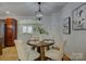 Cozy dining area with seating for four and stylish lighting fixtures, adjacent to the kitchen at 1324 E 35Th St, Charlotte, NC 28205