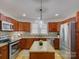 Modern kitchen with stainless steel appliances, granite countertops, and ample cabinet space at 1324 E 35Th St, Charlotte, NC 28205