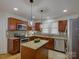 Stylish kitchen with stainless steel appliances, granite countertops, and a central island for food prep at 1324 E 35Th St, Charlotte, NC 28205
