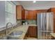 Close up on a kitchen showing stainless steel appliances, granite countertops, and updated sink and fixtures at 1324 E 35Th St, Charlotte, NC 28205