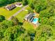 Aerial view of home featuring backyard pool, detached garage and spacious yard at 1355 Woodrun Ct, Rock Hill, SC 29732