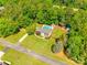 Aerial view of a home with pool, shed and spacious yard surrounded by mature trees at 1355 Woodrun Ct, Rock Hill, SC 29732