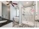 Luxurious bathroom featuring a soaking tub and glass enclosed shower with marble tile at 1355 Woodrun Ct, Rock Hill, SC 29732