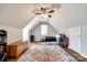 Bedroom with hardwood floors, a unique area rug and sloped ceilings at 1355 Woodrun Ct, Rock Hill, SC 29732