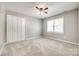 Neutral bedroom with carpeted floors, ceiling fan, and a closet at 1355 Woodrun Ct, Rock Hill, SC 29732