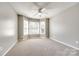 Neutral bedroom featuring a bay window, carpeted floors, and a ceiling fan at 1355 Woodrun Ct, Rock Hill, SC 29732