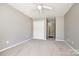 Neutral bedroom featuring carpeted floors, a ceiling fan, and a closet at 1355 Woodrun Ct, Rock Hill, SC 29732