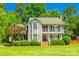 Charming two-story home with a welcoming front porch and beautifully landscaped front yard at 1355 Woodrun Ct, Rock Hill, SC 29732