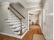Bright foyer with hardwood floors, staircase with white spindles, and an open view to the living room at 1355 Woodrun Ct, Rock Hill, SC 29732
