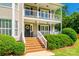 Close-up of the home's entrance with brick steps, white railings, and a charming decorative wreath on the front door at 1355 Woodrun Ct, Rock Hill, SC 29732