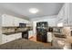 Bright kitchen featuring white cabinets, granite countertops and stainless steel appliances at 1355 Woodrun Ct, Rock Hill, SC 29732