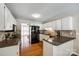 Bright kitchen featuring white cabinets, granite countertops and stainless steel appliances at 1355 Woodrun Ct, Rock Hill, SC 29732