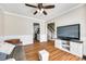 Spacious living room with hardwood floors, neutral walls, ceiling fan, and open doorway to the kitchen at 1355 Woodrun Ct, Rock Hill, SC 29732