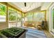 Relaxing screened-in porch with comfortable seating and tranquil outdoor views at 1355 Woodrun Ct, Rock Hill, SC 29732