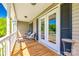 Charming porch with seating area, French doors, and views of the landscaped yard at 1355 Woodrun Ct, Rock Hill, SC 29732