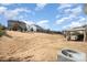 Large backyard with playground, patio area, and lush grass. Fenced for privacy at 15131 Oleander Dr, Charlotte, NC 28278