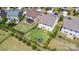 Aerial view of a backyard with a playset, pergola, fire pit, and privacy fence at 15131 Oleander Dr, Charlotte, NC 28278