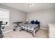 Bedroom with an ironing board, workout bike and natural light at 15131 Oleander Dr, Charlotte, NC 28278