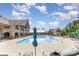 Large community pool surrounded by lounge chairs, umbrellas, and a clubhouse, perfect for summer relaxation at 15131 Oleander Dr, Charlotte, NC 28278