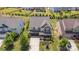 Aerial view of home with beautiful landscaping, covered front porch with chairs, and two car garage at 15131 Oleander Dr, Charlotte, NC 28278