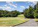 Scenic golf course view showcases manicured greens, mature trees, and a challenging layout for golf enthusiasts at 15131 Oleander Dr, Charlotte, NC 28278