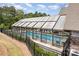Enclosed community pool featuring a glass-paneled structure, providing year-round swimming and recreation at 15131 Oleander Dr, Charlotte, NC 28278