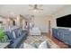 Spacious living room with hardwood floors, a large sofa, stylish decor, and an open layout at 15131 Oleander Dr, Charlotte, NC 28278